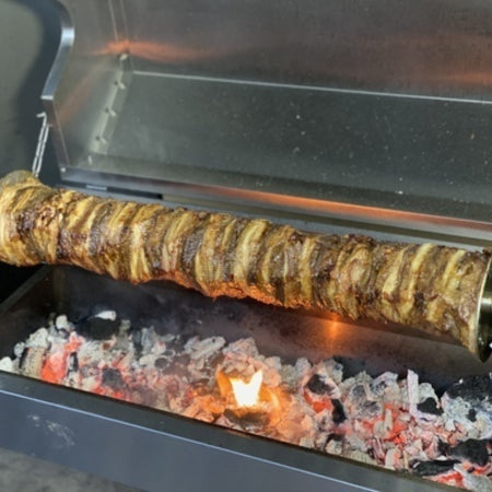 Spit Roaster in action with a full pan of hot coals and cooking a full gyros to perfection