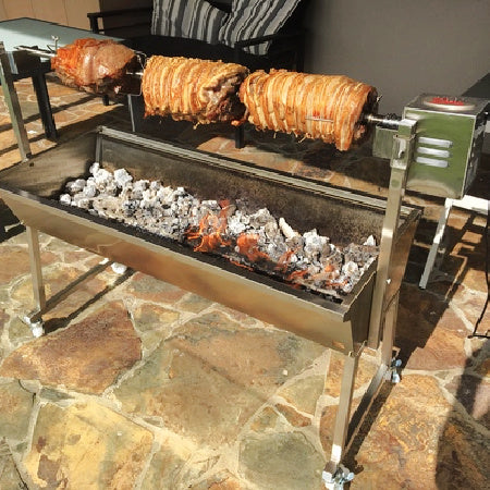 A spit roaster with 3 types of meat showing on the spit