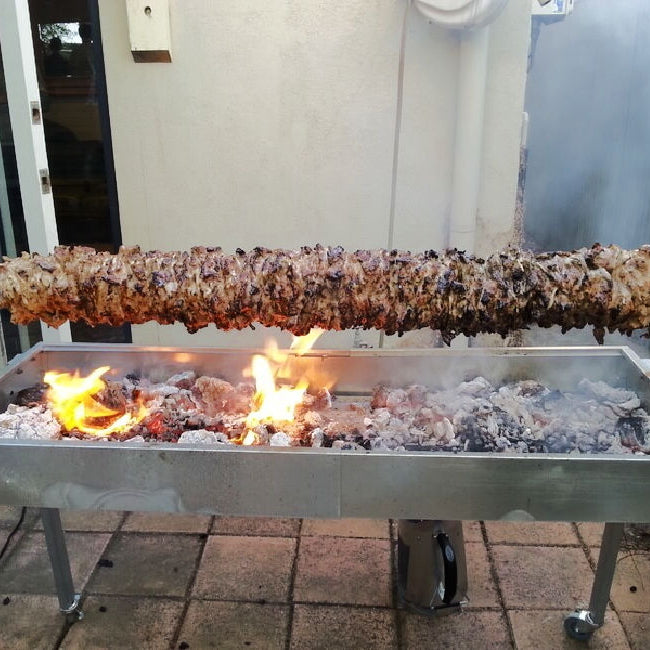 A spit roaster with a full kebab style meat showcasing the guide "Spit Roasters | A Comprehensive Guide"