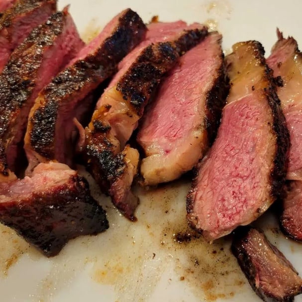 Perfectly cooked medium rare steak on the Pit Barrel Cooker