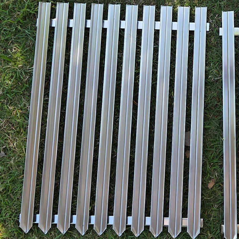 Replacement V-grate & BBQ Rod Grills for OLA Grills Parrilla Argentine showing the v grate on the ground