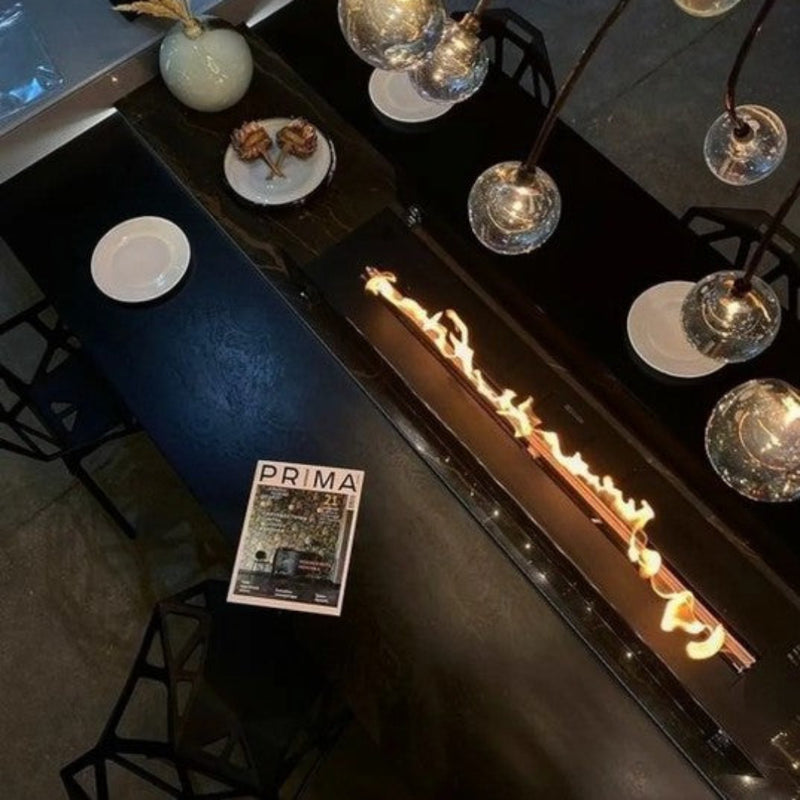 FLA4 BEV Bio Ethanol Fireplace Insert | Indoor showing the top view of one in a table setting