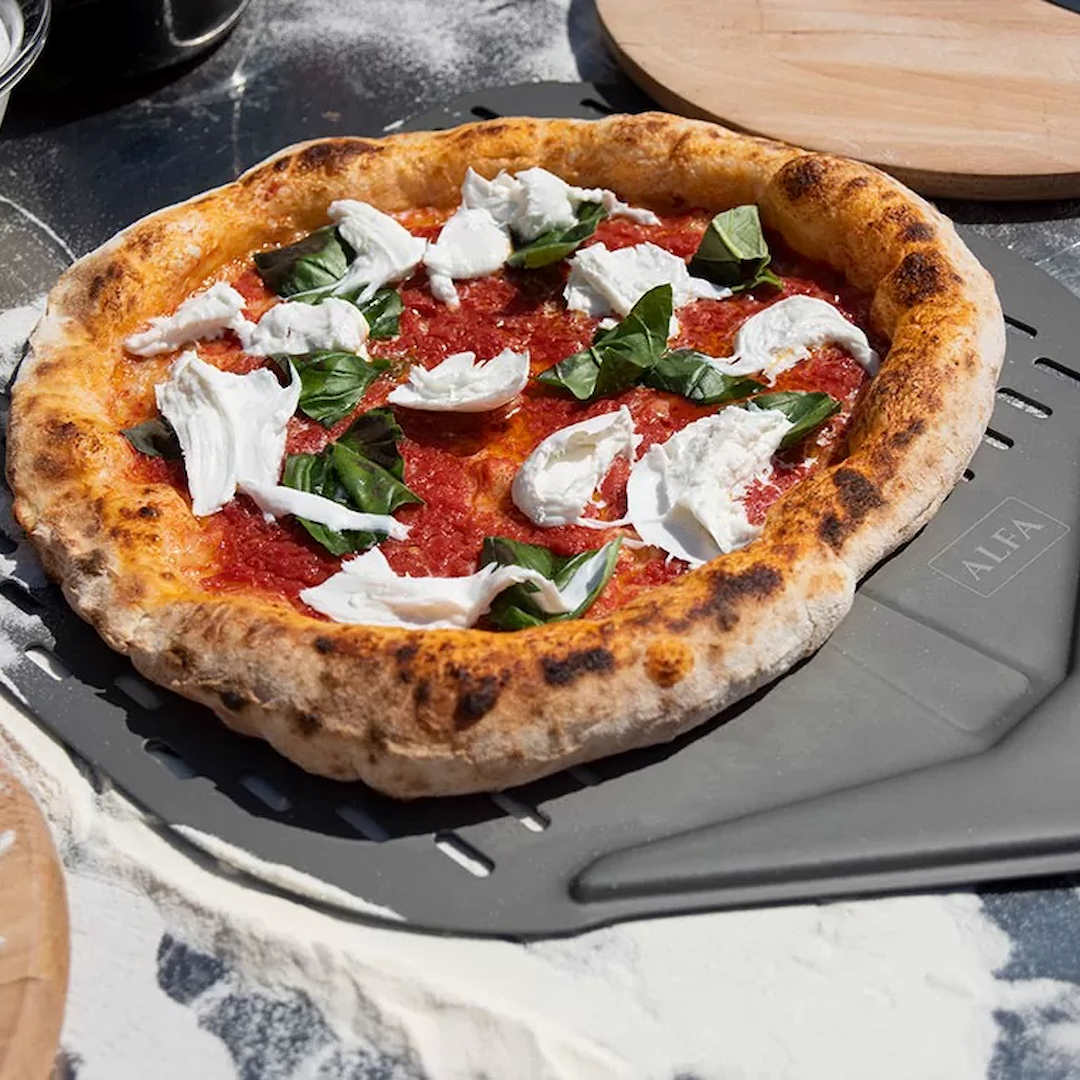 Cooked Neapolitan Pizza on table outside ready to eat