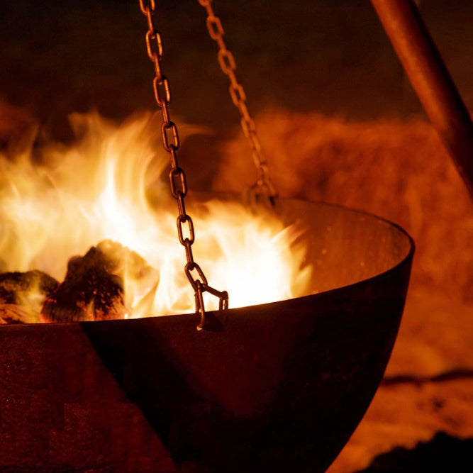 tripod fire pit showing a close up of the bowl lit with fire