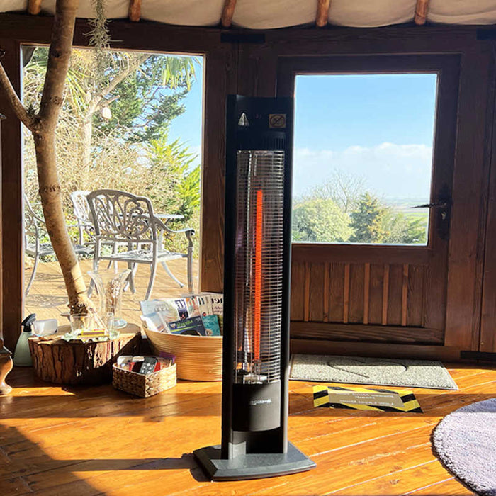 portable infrared heater in a semi outdoor area tht looks like a treehouse escape with a scenic view in the background
