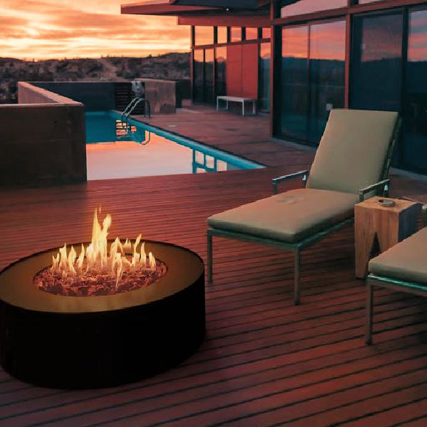 Fireplace Galio star black on deck alight with sunset in the background
