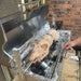 1200 mm Hooded Spartan BBQ Spit Roaster Rotisserie side view with the pig uncooked but prepped on the skewer