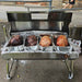 1200 mm Hooded Spartan BBQ Spit Roaster Rotisserie showing meats being cooked in an oven style with the hood open at the end of the cook