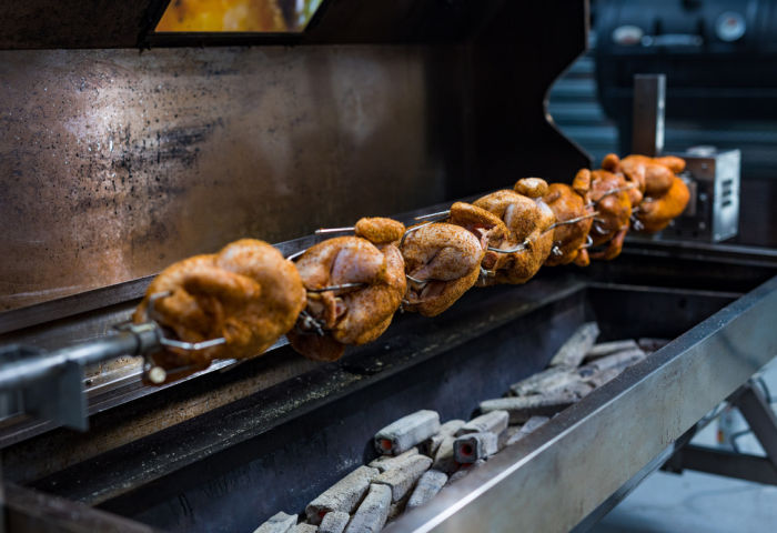 a bunch of chickens on a spartan hooded rotisserie cooking