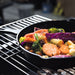 24.5 cm Cast Iron Skillet | BBQ & Camping showing vegies cooking
