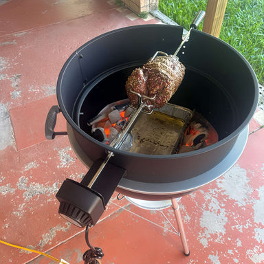 57cm Kettle Rotisserie Kit for the Webber Kettle BBQ close up top view of lamb roasting over coals