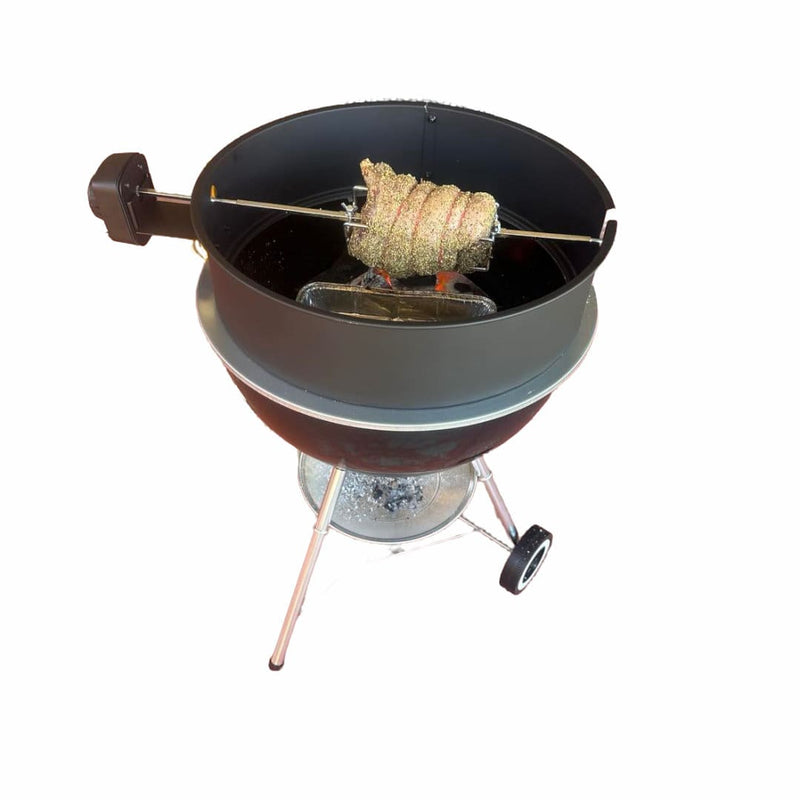 57cm Kettle Rotisserie Kit for the Webber Kettle BBQ roasting a lamb over coals on white background