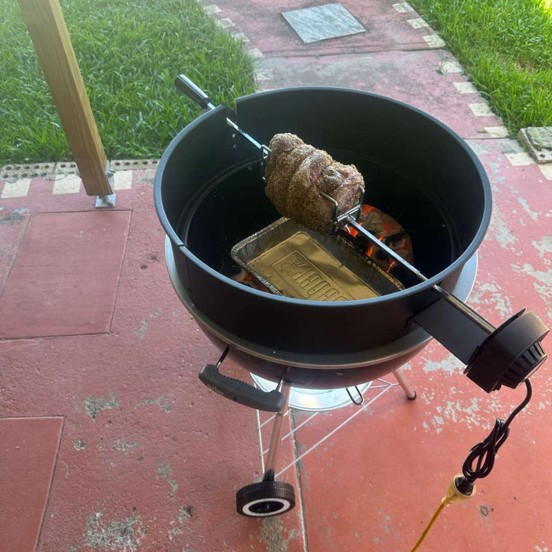 57cm Kettle Rotisserie Kit for the Webber Kettle BBQ top left view of roasting lamb outside