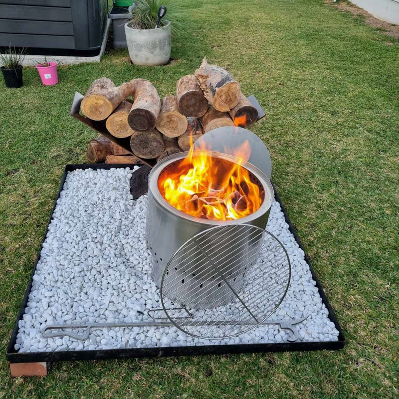 Smokeless Fire Pit With FREE Grill, Lid and Carry Bag showing the 650 mm with fire inside and grill