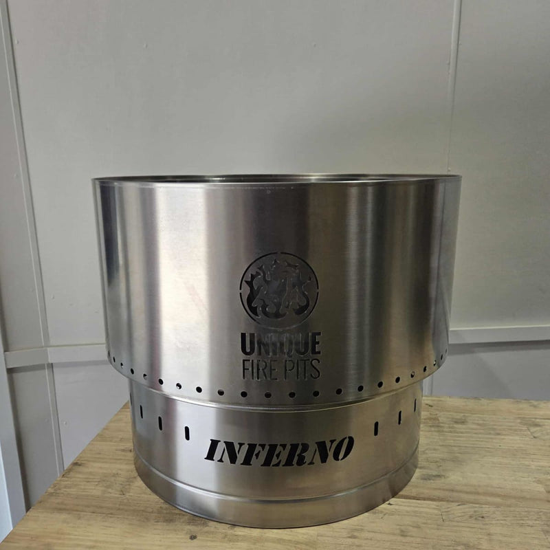 Smokeless Fire Pit With FREE Grill, Lid and Carry Bag showing the 650 mm showing the size on a  table