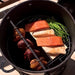 Pit Barrel Smoker & Cooker top view of smoker with salmon inside and chicken and beef hanging