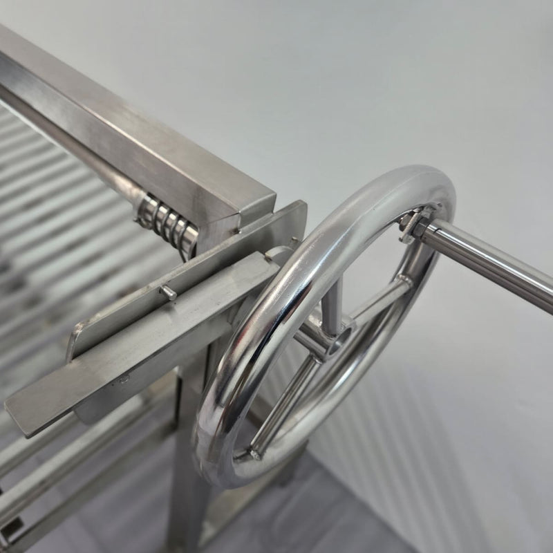 Built-In Parrilla Argentine BBQ Topper | 100% 304 Stainless | V-Grate Model showing a close up of the wheel and horizontal brake
