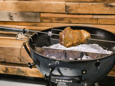 Premium BBQ Rotisserie Kit | view of rotisserie kit on a SNS grill cooking pork
