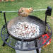 BBQ Grill and Fire Pit full of heat beads with a lamb roast on rotisserie