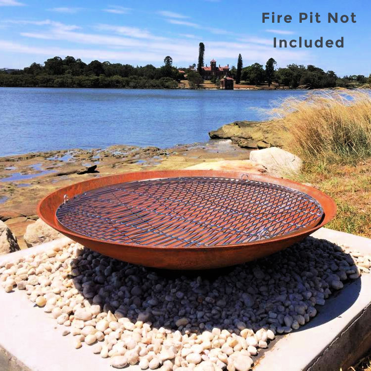 BBQ grill for fire pits in stainless steel  by outdoor living australia. this is sitting on a fire pit for demonstation