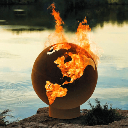 world globe outdoor fire pit sitting next to water by outdoor living australia