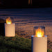 Fireplace Totem Commerce - two totems on grass next to sand