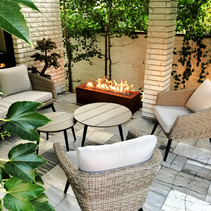 Fireplace | Galio Automatic view of corten fireplace in back patio area