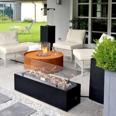 Fireplace Galio manual series - view of black fireplace in outdoor setting with other fireplaces