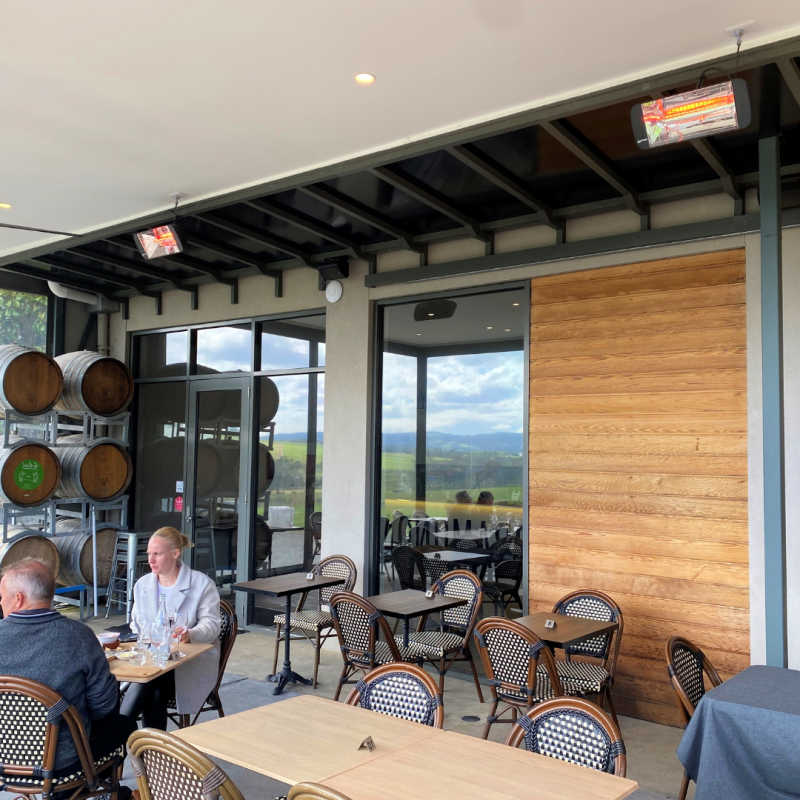 Infrared Heater | Outdoor | Electric | Heliosa 66 outside a cafe with people eating