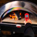 Infrared Thermometer | pointing at fire inside pizza oven