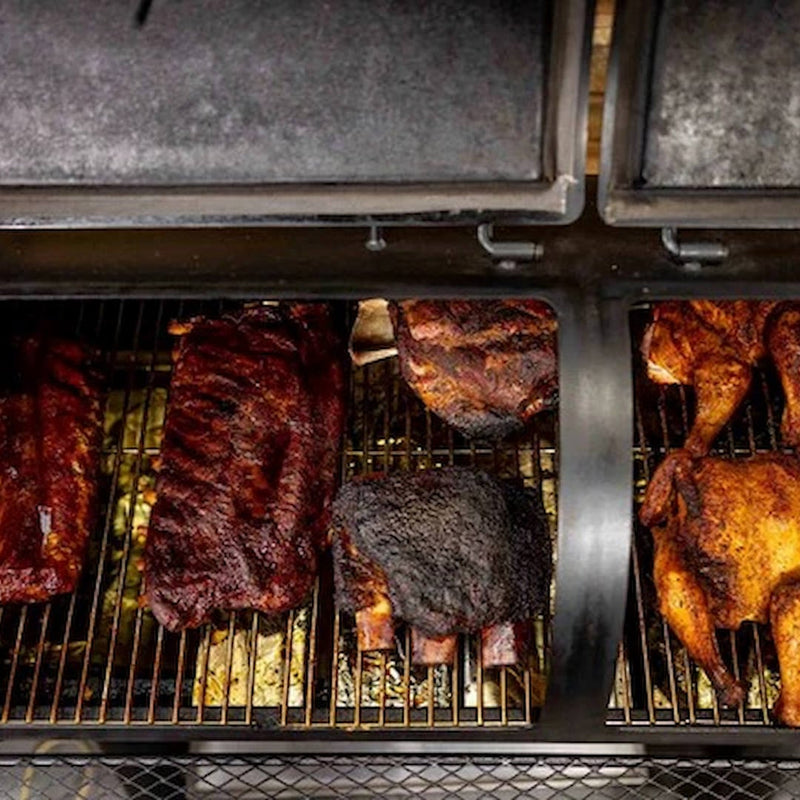 Offset Smoker Flaming Coals top view cooking 2 beef short ribs, 2 Louisiana ribs, 2 chickens