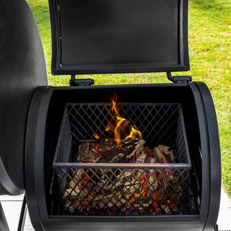 Offset Smoker | Char-Griller Grand Champ  close up view of the firebox with a fire inside