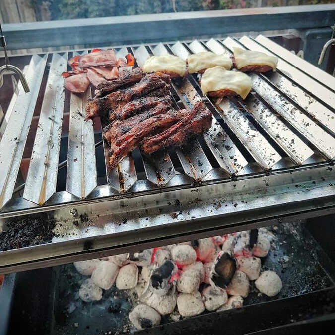 Parrilla BBQ Grill | Argentine | Optional Spit with food on it under charcoal