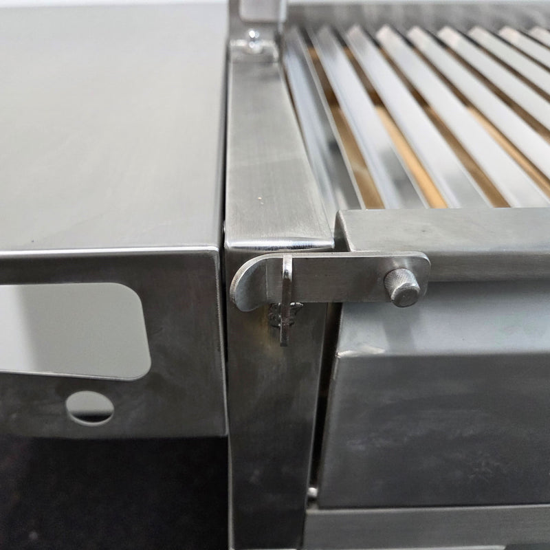 Parrilla Argentine BBQ with Firebricks | 100% 304 Stainless | South American Style Cooking showing the door lock