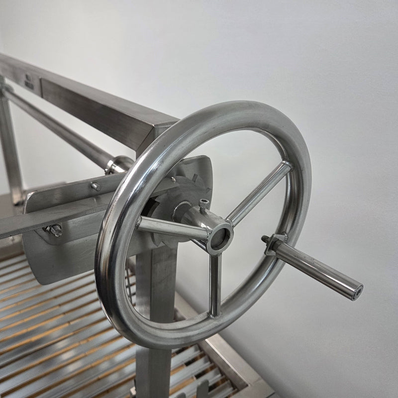 Parrilla Argentine BBQ with Firebricks | 100% 304 Stainless | South American Style Cooking showing the wheel