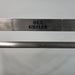 Parrilla Argentine BBQ with Firebricks | 100% 304 Stainless | South American Style Cooking showing a close up fo the OLA Grills Tag