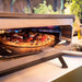 Gas Pizza Oven | 13 or 17 Inch | Cozze MK2 close up view of pizza cooking inside 