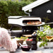 Electric Pizza Oven | Cozze White 13 Inch front left view of pizza oven in outdoor area