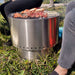 Smokeless Fire Pit | showing people cooking on the grill