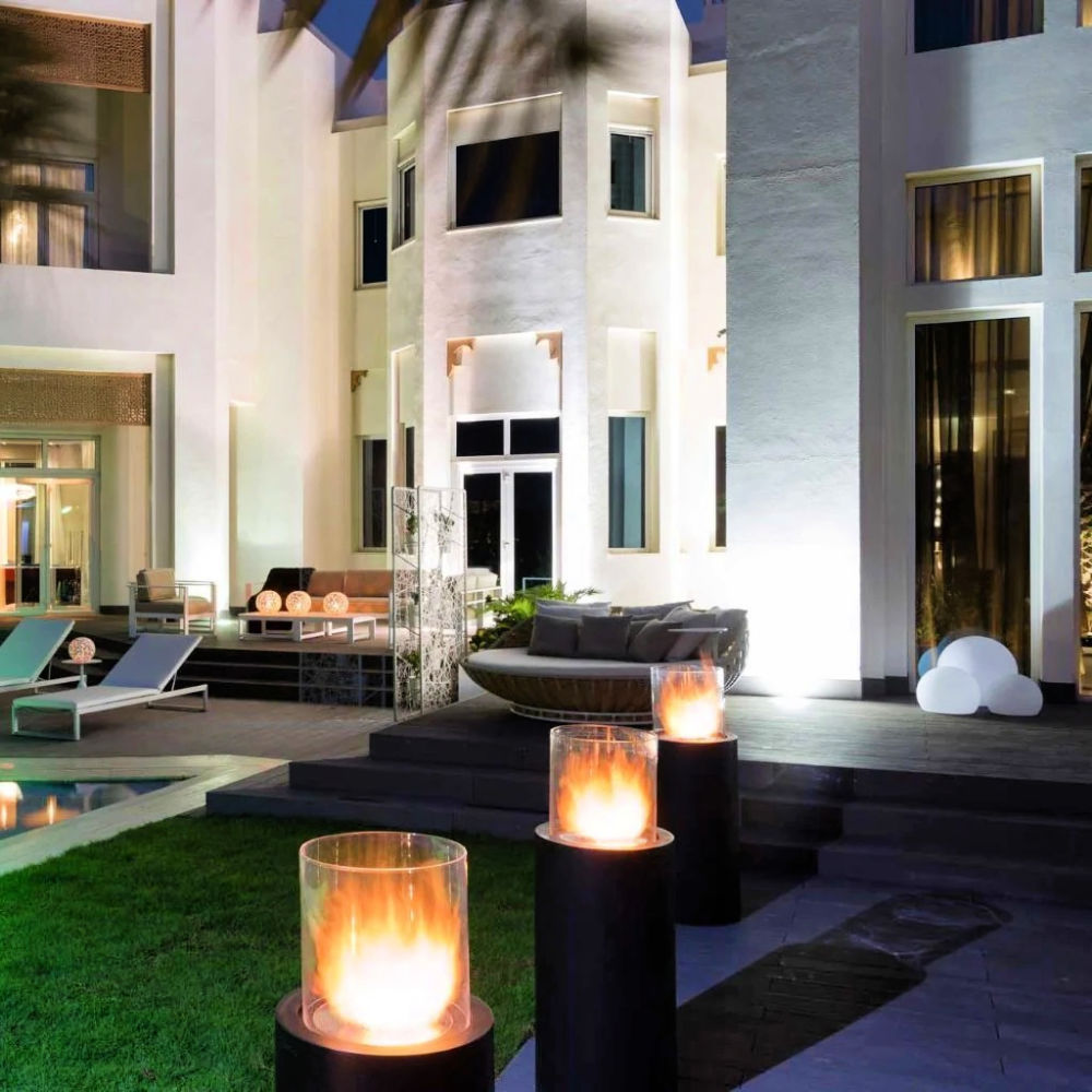 Fireplace Totem Commerce - multiple totems set up in outdoor pool area