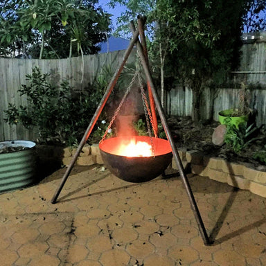 Tripod Fire Pit in outdoor area with fire inside