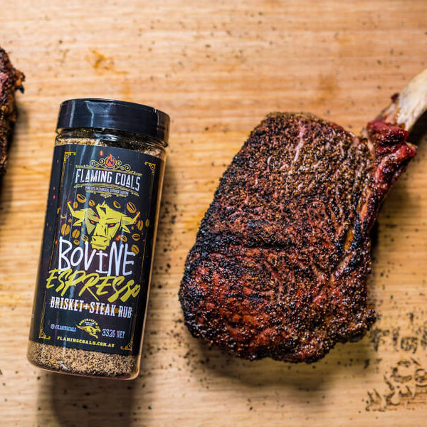 The Ultimate Rub Pack | view of the bovine Espresso rub sitting next to a cooked tomahawk