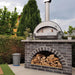 Wood Fired Pizza Oven | Alfa 4 Pizze sitting on top of a brick firewood storage area