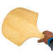 Wooden Pizza Peel | view of someone holding the pizza peel on white background