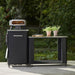Outdoor Kitchen 115 Open  – Stainless 115×60 Top | Modular | Cozze sitting next to a tall pizza oven table