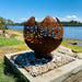 Outdoor Globe Fire Pits | World | ANZAC | Death Star | Leaf showing the leaf model near water