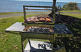 Parrilla Argentine BBQ with Firebricks | 100% 304 Stainless | South American Style Cooking showing the full grill with meat