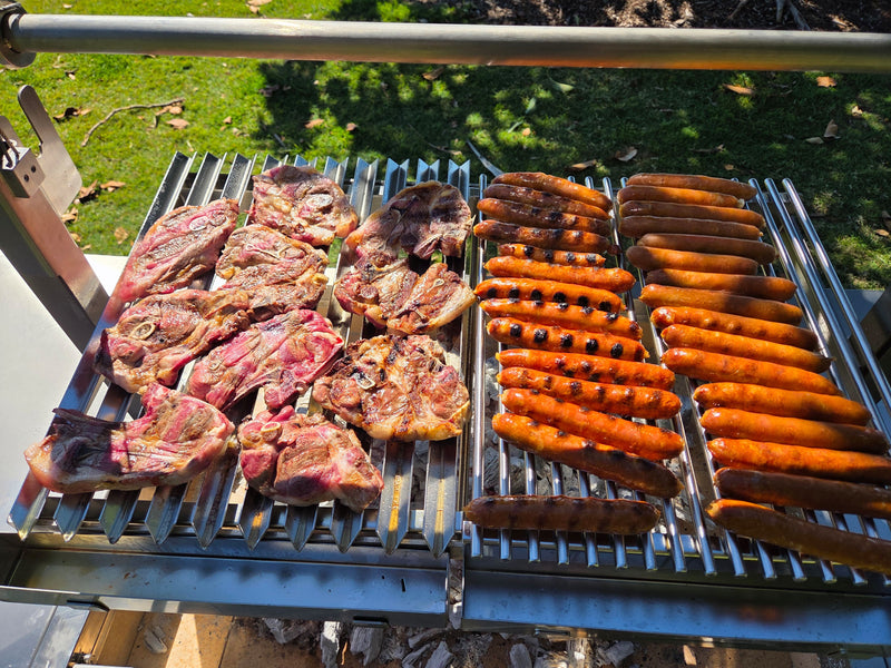 Parrilla Argentine BBQ with Firebricks | 100% 304 Stainless | South American Style Cooking showing it full of meat