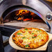Marine Grade Pizza Oven | 316 SS | Wood Fired close up of cooked pizza on a  wooden peel