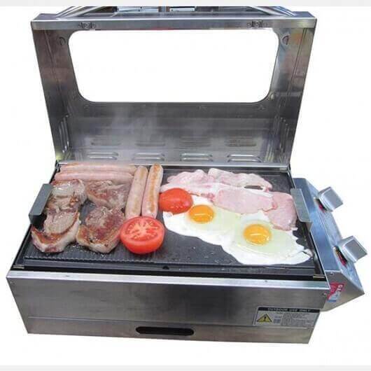 Portable BBQ Grill | Caravan | Sizzler Deluxe with food cooking as a size guide